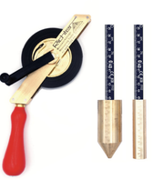 Richter 464-MS-103 tank dipping tape with brass frame, red handle, stainless steel tape on a dark background and brass dip weights